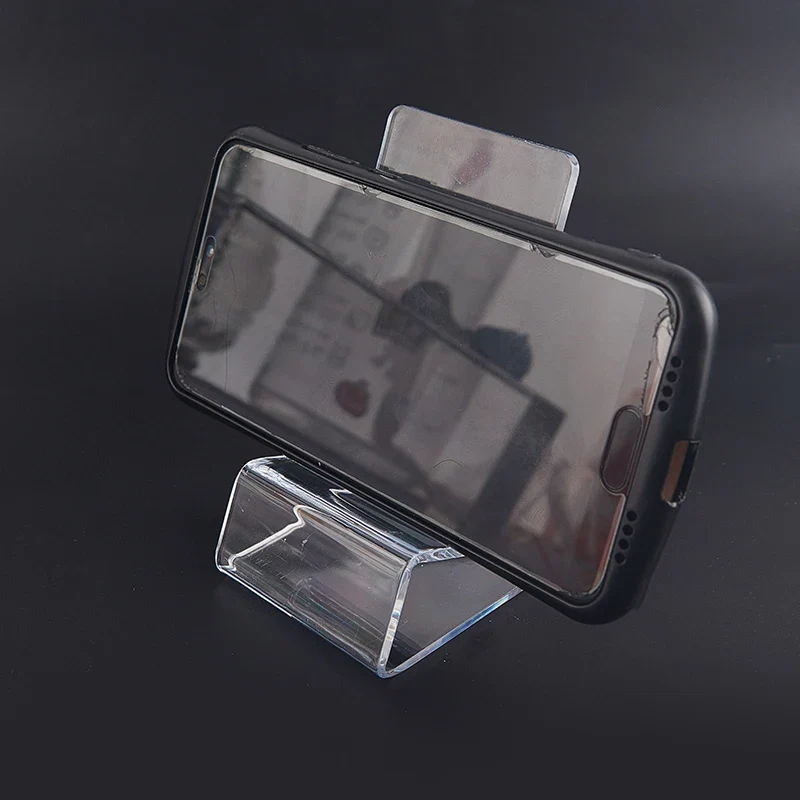 Présentoir acrylique transparent — console portable et smartphone