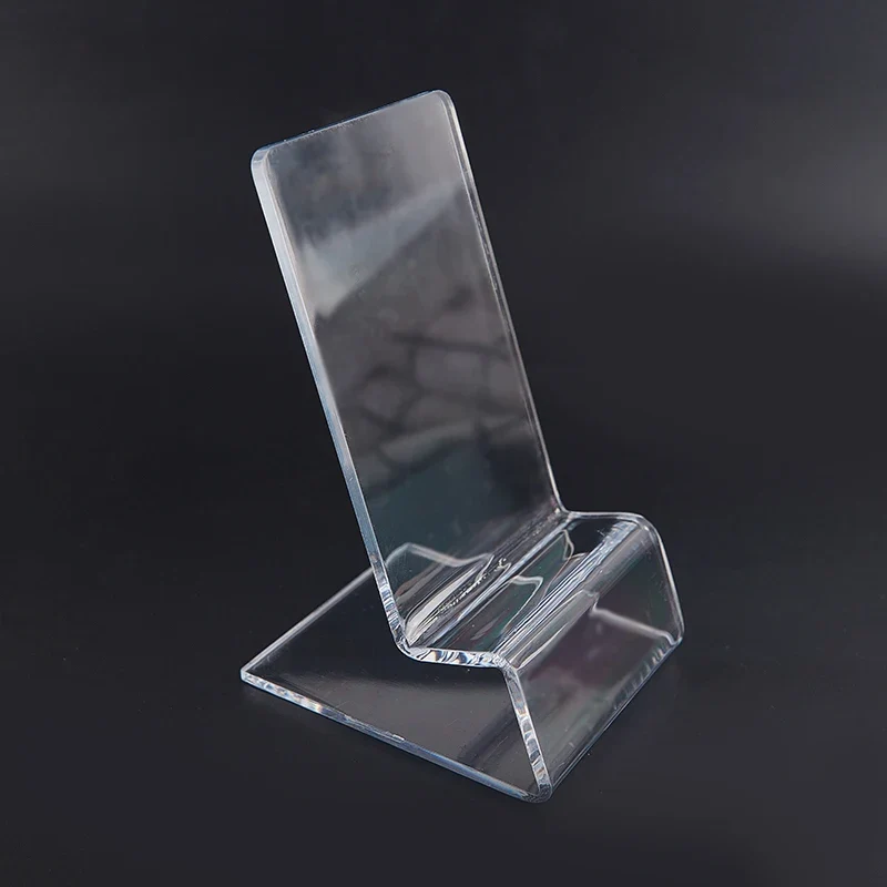 Présentoir acrylique transparent — console portable et smartphone