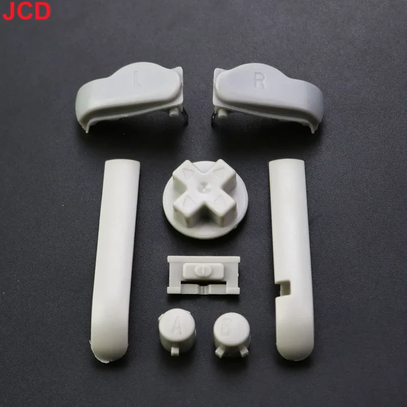 Jeu de boutons Game Boy Advance — A/B, croix, L/R, 15 coloris