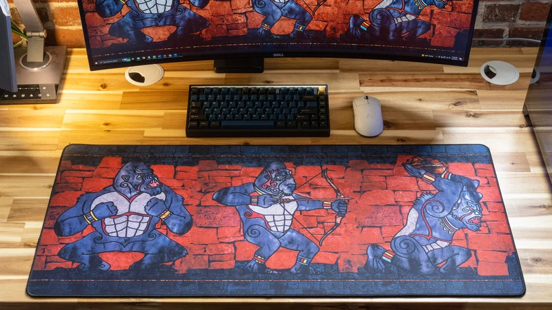 "ANCIENT OOKS" — Rust Deskmat